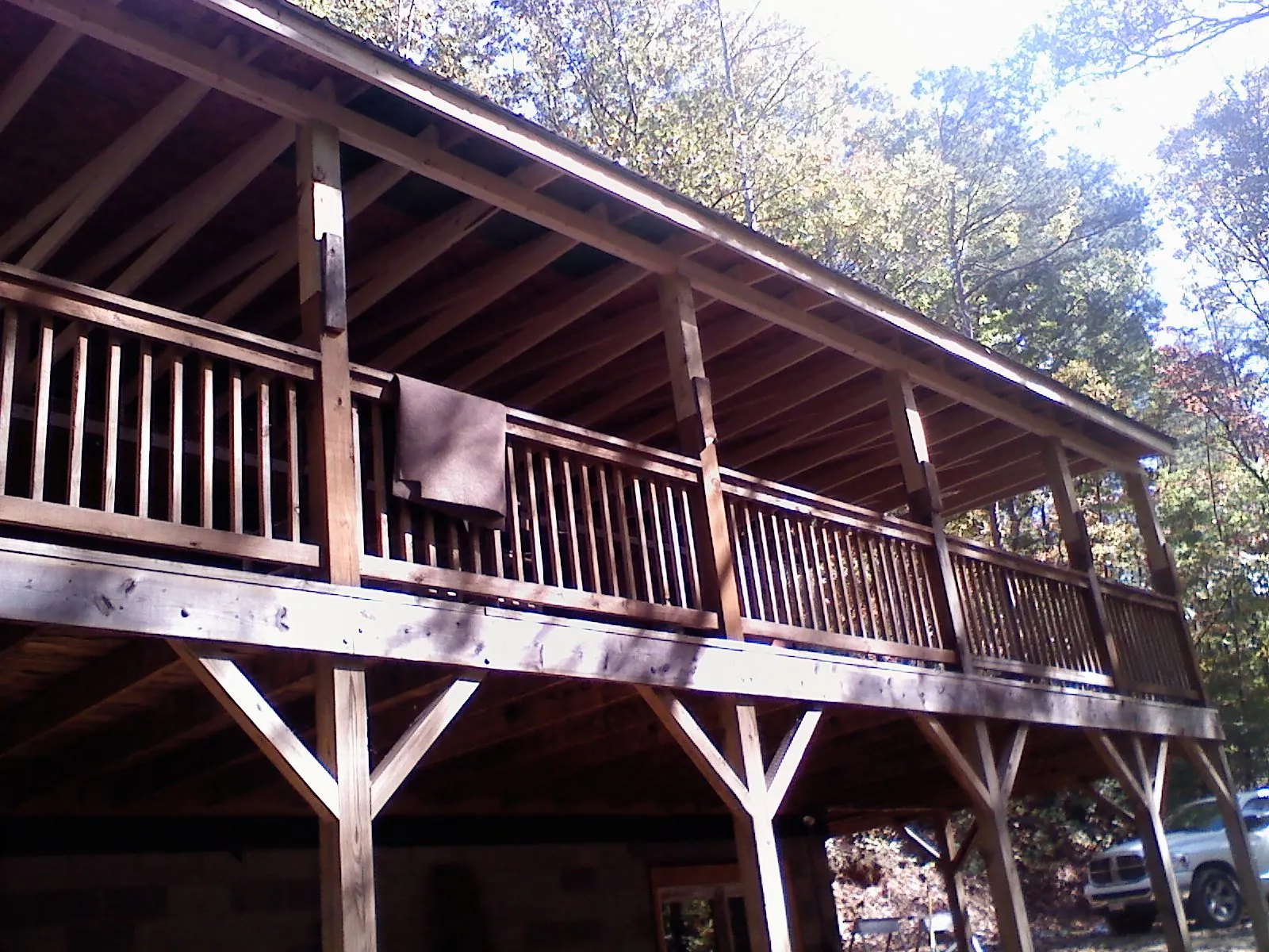 Timber framing under a new elevated porch and deck — Roof Leak Repair in Struthers by Roofing Brothers
